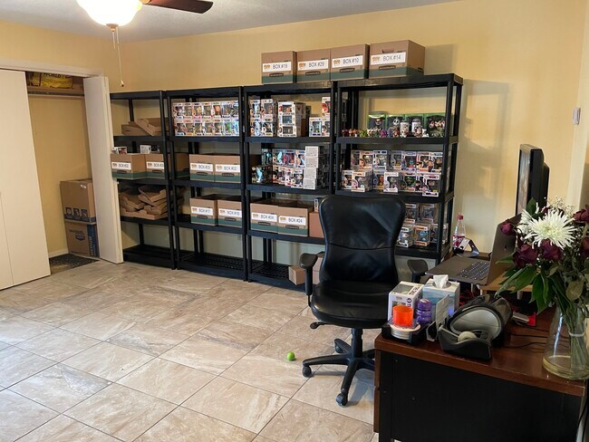 Open concept living room, located across from the kitchen. Harbor breeze and bronze fixtures. - 6905 SW Regional Airport Blvd
