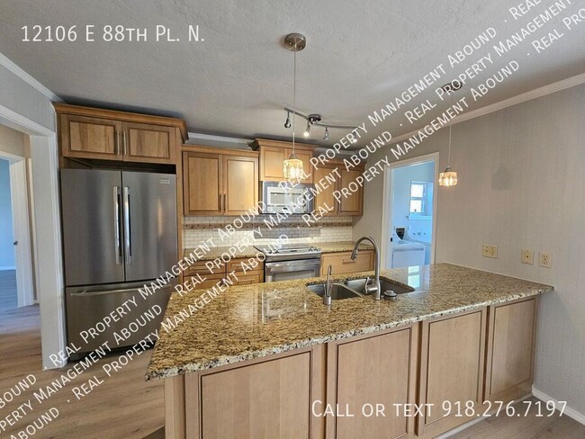 Foto del edificio - 12106 E 88th Pl N