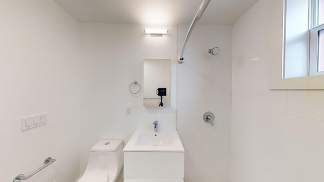 Bathroom with a toilet, sink and walk-in shower - 2500 Durant Avenue