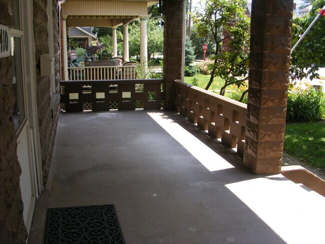 Building Photo - Located on a quiet shady street!