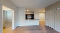This single-story, 3-bedroom residence offers a clean, modern layout designed for comfortable everyday living. The open-concept living and kitchen area serves as the heart of the home, where a peninsula with granite countertops creates a natural divide between the two spaces while maintaining visual connectivity. The kitchen is equipped with dark espresso cabinetry, granite countertops, and a full suite of black appliances including a refrigerator, range, and built-in microwave.

Wood-style plank flooring runs throughout the main living areas and bedrooms, providing a cohesive and easy-to-maintain surface underfoot. The living area is generously sized, with neutral-toned walls and recessed lighting contributing to a bright, airy atmosphere.

Each bedroom is well-proportioned and features ceiling fans, wood-style flooring, and windows that allow natural light to filter in. Select bedrooms include double-door closets for added storage. The bathroom features light tile flooring, a dark vanity with granite countertops, a large mirror, and a full tub and shower combination. The overall design is consistent and neutral, creating a versatile and functional living environment.