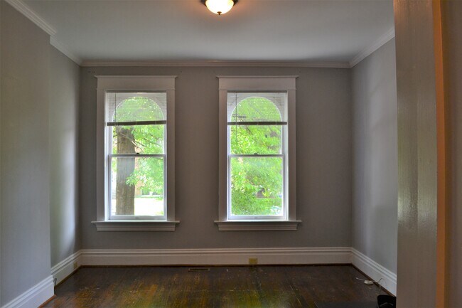 A view from the dining room, looking into the living room. - 3445 Shenandoah Ave