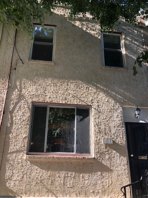 Exterior on a quiet tree-lined street - 1931 Montrose St