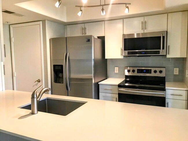 Updated cabinets - Glass tile backsplash - 1333 E Morten Ave