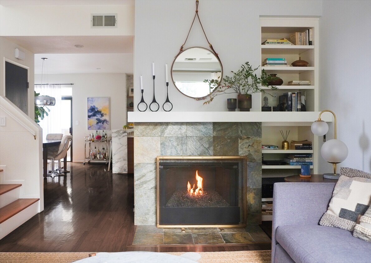 Open floor plan living room with gas fireplace and built-ins - 2201 7th St