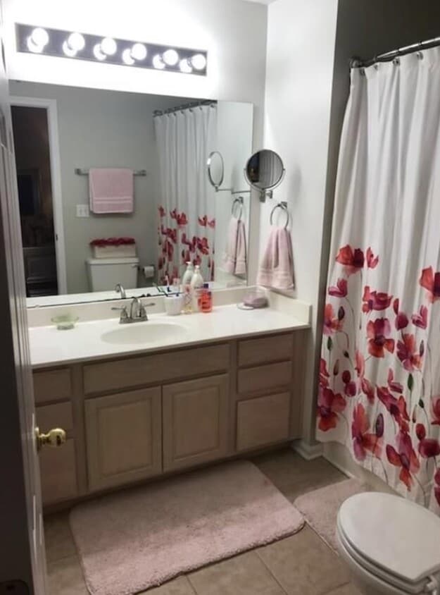 Master bath has two vanities and a tub shower combo. - 231 Legacy Lane