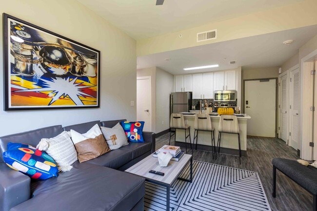 Valentine-Commons-Off-Campus-Apartments-Just-Steps-From-NC-State-University-Platinum-Floor-Plans-Living-Room-Common-Area-to-Open-Kitchen - Valentine Commons Apartments