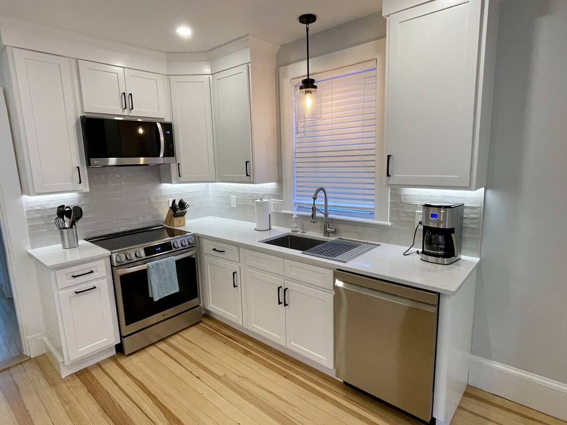 Kitchen with induction range and 32" sink. All new appliances - 99 Hudson St