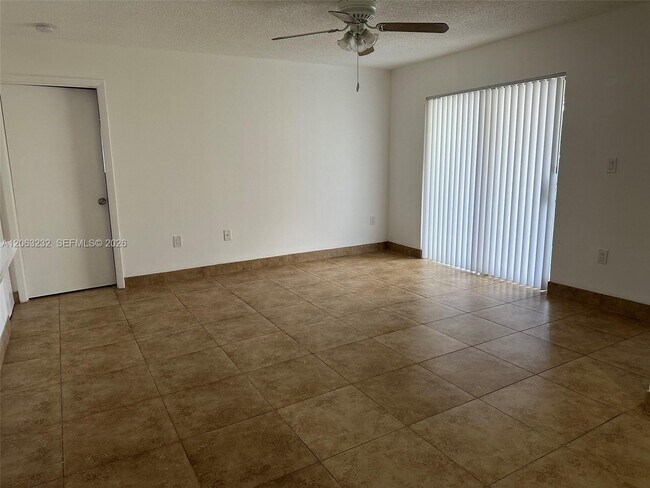 Building Photo - 9491 Palm Cir S