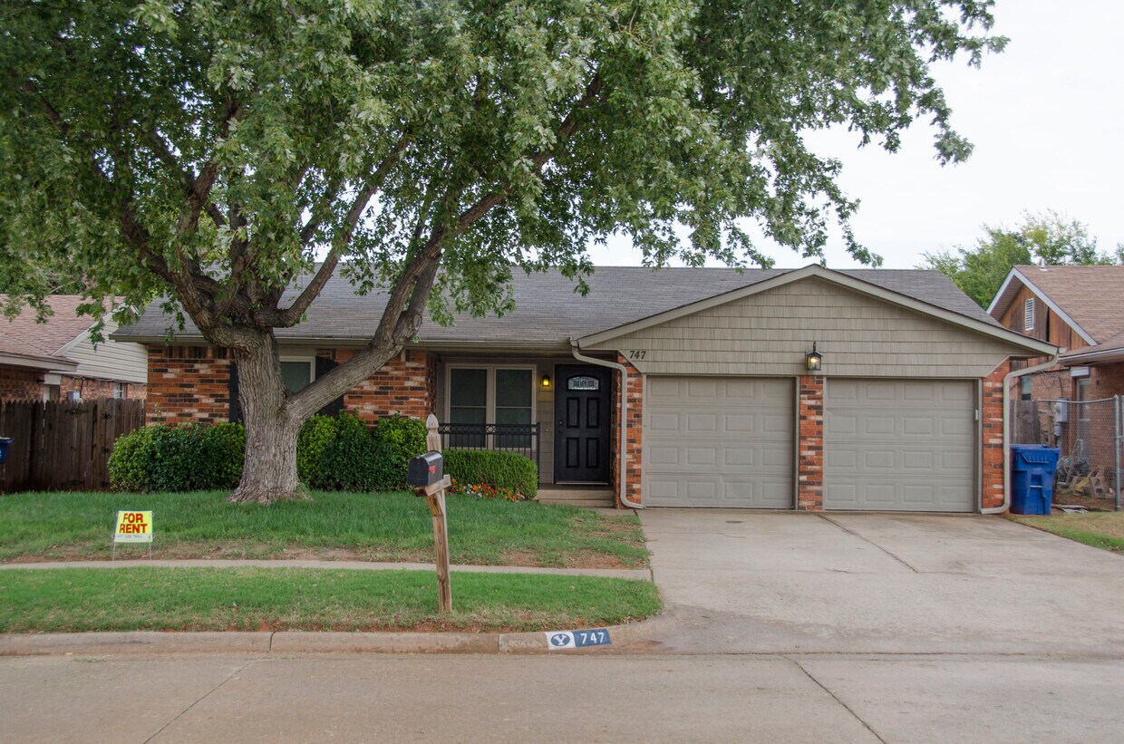 Updated Mustang home. Updated exterior lighting, vinyl shaker single siding and doors. New windows, covered front porch, 2 car garage with shelving and storage, and lawn care services provided. Located in Mustang. - 747 W Forest Dr (Mustang, OK)