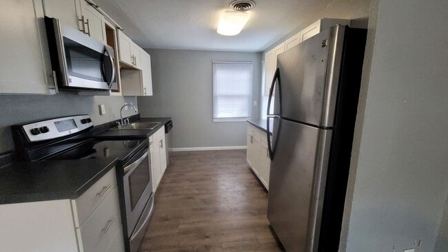 Building Photo - NE 3 bedroom updated with appliances and garage