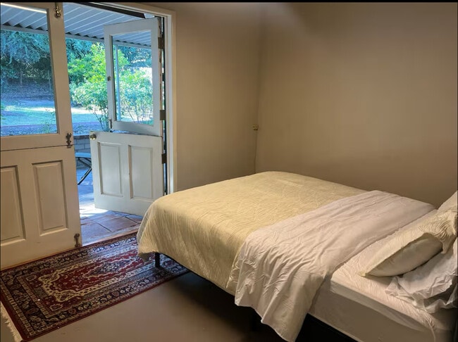 Bedroom 2 Leading out to back patioi. - 965 Jane Pl