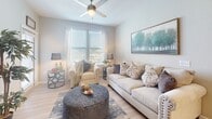 Located at 14809 Ralston Road in Humble, TX, this single-story residence offers a well-designed layout with thoughtfully appointed interiors throughout. The kitchen is a standout feature, showcasing rich dark cabinetry, granite countertops, stainless steel appliances including a range, microwave, and refrigerator, paired with light hardwood-style flooring and a classic tile backsplash. A peninsula with pendant lighting connects the kitchen to the entryway, creating an open and inviting flow.

The living room is bright and comfortable, benefiting from large windows that invite natural light, and is complete with a ceiling fan overhead. The dining area offers an intimate setting with carpeted flooring and a closet nearby for added storage.

The primary bedroom features carpeted floors, a window with natural light, and ample space for furnishings. A second bedroom, accented with a bold accent wall, also offers carpeted floors and a ceiling fan. Two bathrooms serve the home — one with a soaking tub framed by large-format tile surround and dark cabinetry, and another with a shower and matching granite vanity. Hardwood-style flooring runs through the main living areas, tying the home's cohesive, modern aesthetic together.
