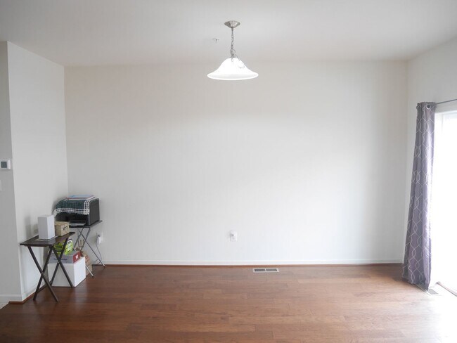 Building Photo - Beautiful 4-Bedroom Townhouse with Garage, Deck & Community Amenities