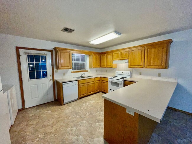 Building Photo - 2/2 with Outdoor Storage, Single Carport, ...