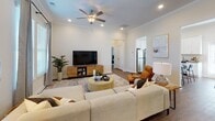 Located at 512 Murray Park Loop in Myrtle Beach, South Carolina, this single-story home offers a thoughtfully designed layout with a warm coastal aesthetic throughout. The living room serves as a welcoming central hub, featuring crown molding, recessed lighting, a ceiling fan, and hardwood-style flooring. Natural light streams in through multiple windows dressed with classic plantation shutters, complementing the neutral palette and open feel of the space.

The kitchen is a standout feature, outfitted with crisp white shaker cabinetry, granite countertops, a full suite of stainless steel appliances, and hardwood-style flooring. A kitchen island provides additional prep and gathering space, while a window above the sink brings in natural light.

The dining area connects seamlessly to the rest of the home, with French doors offering access to the outdoors and contributing to an airy, light-filled atmosphere. Crown molding adds a refined finishing touch to this space.

The bedrooms are comfortably sized, each with double-door closets, plantation shutters, and neutral tones that create a calm, restful environment. Two full bathrooms include tub-shower combinations, providing practical functionality. A dedicated laundry room with a full-size washer and dryer and overhead shelving rounds out this well-equipped home.