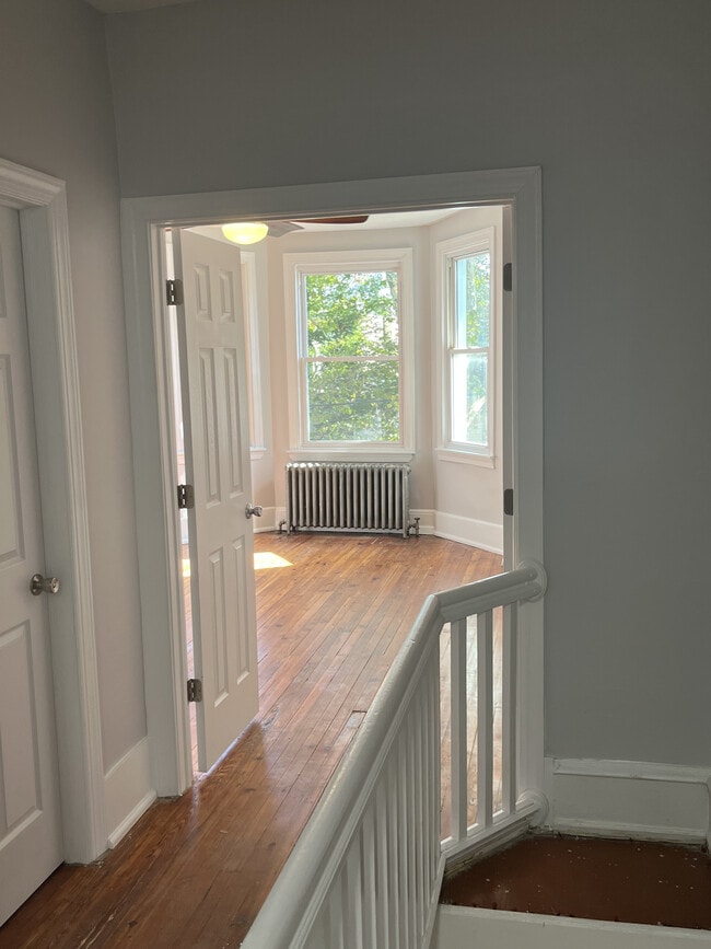 upstairs image of bedroom 1, fully updated with new ceiling fan - 5143 Catharine St