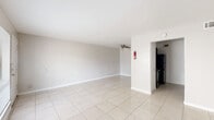 Located at 7222 S Gessner Dr in Houston, TX, this single-story 1-bedroom, 1-bathroom unit offers a practical and well-organized layout. Light-colored ceramic tile flooring runs throughout the entire space, creating a clean, cohesive look that reflects natural light across each room.

The open living and dining area is bright and airy, featuring a ceiling fan and neutral white walls that enhance the sense of space. The layout flows naturally from the living area toward the kitchen, which is equipped with dark espresso cabinetry, granite-style countertops, a double stainless steel sink, a tiled backsplash with a decorative mosaic accent strip, and black appliances including a refrigerator and dishwasher. A pantry provides additional storage conveniently nearby.

The spacious bedroom features its own ceiling fan, a large window that fills the room with natural light, and direct access to a walk-in closet. With four closets total throughout the unit, storage is a notable strength of this layout. The bathroom is clean and straightforward, featuring tile flooring and a full bathtub and shower combination.

A hallway connects the main living areas to the private sleeping quarters, and the unit benefits from multiple windows that bring in natural light throughout the day.