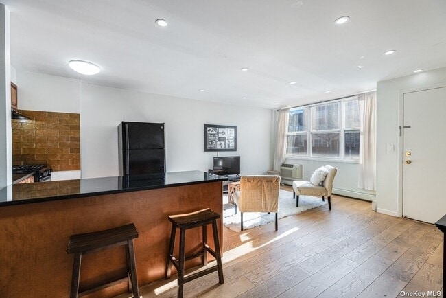 Note, living room will not be furnished. - 591 Vandalia Ave