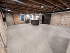 A view of the open concept kitchen/dining/living area. Photo may not be exact. - 130 E State St