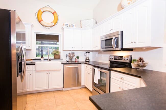 Building Photo - ANNUAL RENTAL - Beach Cottage with 2 Car Garage 'The Lakehouse' in tropical garden