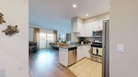 Located at 2625 E Date Palm Paseo in Ontario, CA, this well-appointed single-floor residence features 3 bedrooms and 2 bathrooms thoughtfully arranged for comfortable living. The open-concept kitchen and living area serves as the heart of the home, where crisp white cabinetry, gray countertops, and a full suite of stainless steel appliances — including a gas range, microwave, dishwasher, and refrigerator — create a functional and modern cooking space. Light tile flooring in the kitchen transitions seamlessly to warm wood-style flooring throughout the living and dining areas. The living room is bright and welcoming, featuring a sliding glass door that opens to an outdoor space, inviting natural light and fresh air. The primary bedroom offers a generous footprint with a private sliding door, built-in wall shelving, and ample natural light. The second bedroom is equally bright, benefiting from multiple windows. Both bathrooms are finished with white vanity cabinetry, gray countertops, and tub-shower combinations with tile flooring. A connecting hallway links the bedrooms and bathrooms for a practical and cohesive flow throughout the residence.