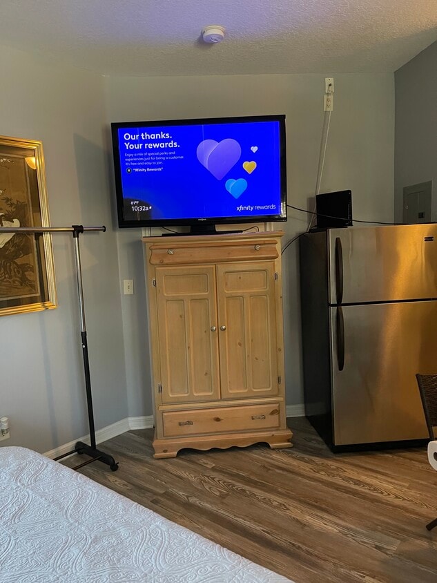 Fridge and TV - 9921 Perfect Dr