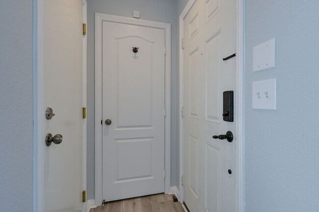 Building Photo - NW!! Gated!! Community Pool/Spa  Recreation Room!! New Paint!! New Flooring!!  Balcony!!  2 car g...