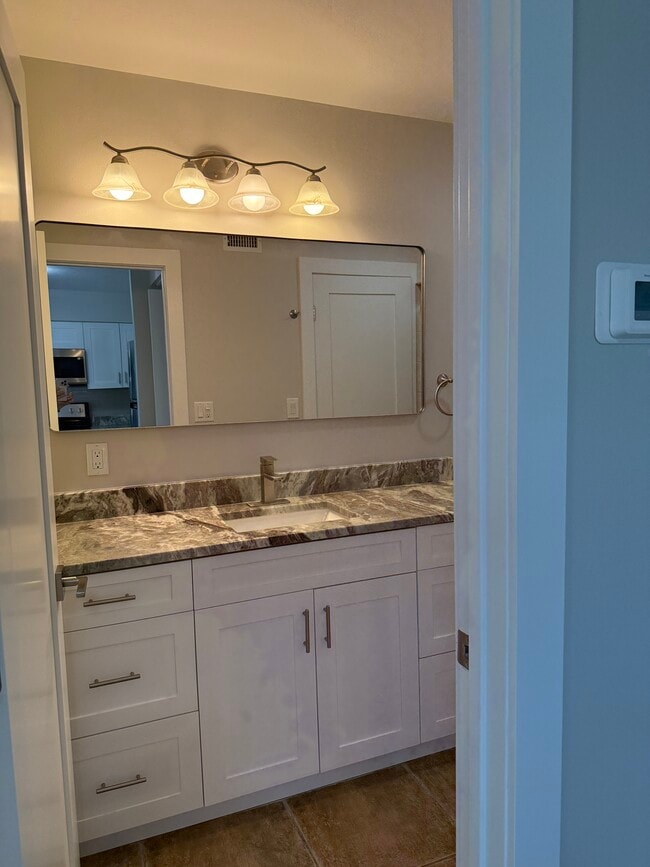 Granite countertop in the bathroom. - 7006 Midnight Pass Rd
