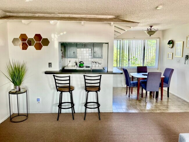 Bar top, kitchen & dining area from living room view - 1010 S Atlantic Blvd