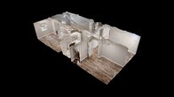 Located at 2820 Browns Dr in Henderson, Kentucky, this single-floor, 3-bedroom, 1-bathroom unit offers a practical and well-maintained living space. Throughout the home, wood-look luxury vinyl plank flooring provides a cohesive and durable finish, complemented by neutral gray walls and white trim.

The kitchen is outfitted with white shaker-style cabinetry extending to the ceiling for ample storage, granite-look countertops, a double sink, and white appliances including a refrigerator and electric range. A textured ceiling and flush-mount lighting complete the functional space.

Each of the three bedrooms features LVP flooring and its own closet with a hanging rod. The spacious primary bedroom includes a large walk-in-style closet, while the secondary bedrooms offer standard reach-in closets. One bedroom features an exposed painted concrete block wall with a window that brings in natural light, adding a distinctive character to the room.

The bathroom includes a tub/shower combination, a toilet, and a single-sink vanity with white cabinetry, all set on wood-look tile flooring. A central hallway connects the bedrooms to the main living areas, and a dedicated entry door leads directly into one of the rooms. The textured ceilings are consistent throughout, giving the home a uniform, tidy appearance.