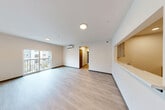 Located at 4901 S 25th St in Tacoma, WA, this thoughtfully designed 2-bedroom, 2-bathroom single-floor residence offers a clean, contemporary aesthetic throughout. Light wood-style flooring flows seamlessly across the entire unit, complementing the crisp white walls and neutral color palette that create a bright, welcoming atmosphere.

The open-concept living area is generously proportioned, featuring a wall-mounted mini-split system for climate control and large sliding glass doors that open onto a private balcony, allowing abundant natural light to fill the space. The kitchen is accessible via a pass-through window opening, fitted with light wood cabinetry, stone-look countertops, stainless steel appliances including a refrigerator, range, and microwave, making it both functional and stylish.

The hallway connects to both bedrooms, each offering a calm, neutral environment with wood-style flooring and natural light from windows with blinds. The primary bedroom is comfortably sized and features its own dedicated closet. Both bathrooms are finished with marble-look countertops and light wood vanity cabinetry, with one bathroom featuring a walk-in shower.

Additional highlights include a dedicated laundry area, two closets for ample storage, and an entrance that leads directly into the main living space.