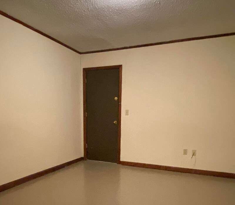 Bedroom view 2: Door to backyard, shed, and parking. - 1109 North Yale Street