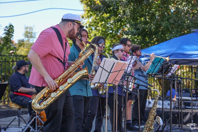 Listen to the live local music play at Methuen Days.