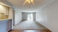 Located at 301 N 70th Terr in Kansas City, KS, this single-floor residence offers four bedrooms and four bathrooms within a practical and well-organized layout. The living room is a bright, open space featuring carpet flooring, a ceiling fan with light fixture, and a sliding glass door that opens to a private balcony, allowing natural light to fill the room. The kitchen is efficiently designed with white cabinetry, a double-basin sink, white electric range, and hardwood-style flooring, complemented by a textured ceiling and under-cabinet lighting. Each of the four bedrooms features neutral carpet flooring, soft gray walls, and individual closets, with several rooms equipped with ceiling fans. Natural light enters through windows fitted with blinds, lending each room a calm, functional atmosphere. The four bathrooms are straightforward in design, featuring tub-shower combinations, hardwood-style flooring, and clean white fixtures. Two hallways connect the rooms throughout the unit, ensuring smooth circulation. Textured ceilings are consistent throughout the space, adding subtle architectural character. This residence offers a balanced combination of bedroom and bathroom count, making it well-suited for shared or family occupancy.