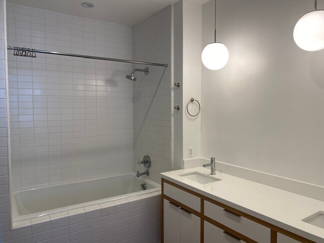 Primary bath has two sinks and deep soaked tub - 212 Marine St