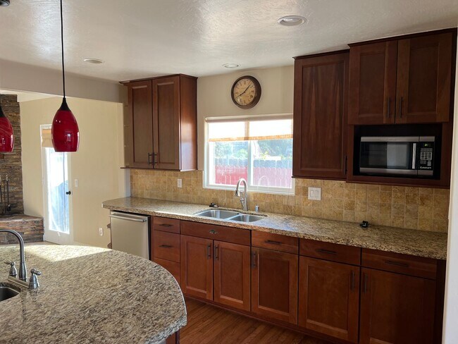 Building Photo - Updated 2BR/1BA with a pool, solar and yar...