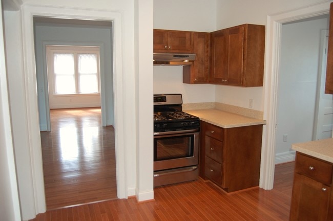 Kitchen with new stainless steel appliances and custom cabinetry - 485 Elmwood Ave