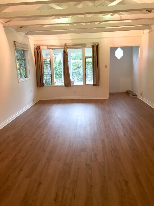 actual airy living/dining space with raftered ceiling - 1372 Neola St