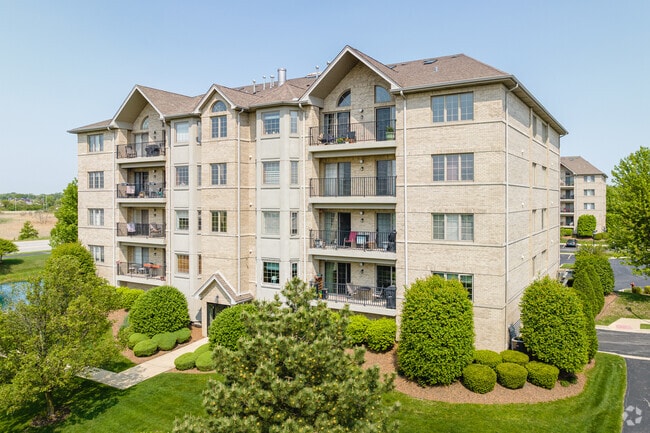 Woodridge condominiums feature balconies and well-landscaped green space.