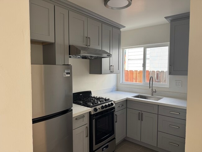 Energy efficient appliances with fresh counter tops, sink, disposal, gas stove and oven. - 83 N 11th St