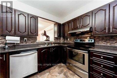 Photo du bâtiment - 410-410 McLevin Ave