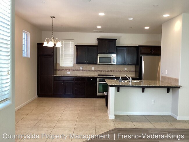 Building Photo - 3 br, 2.5 bath House - 7009 N. Harmony Drive