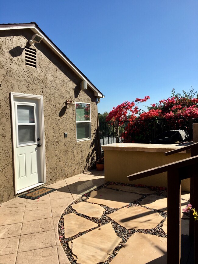 Front door to studio with BBQ outside - 4818 Austin Dr