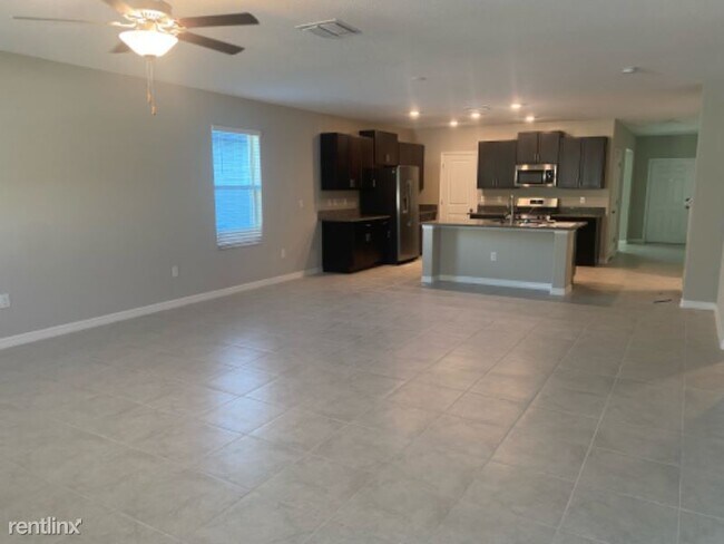 Foto del edificio - 5 br, 2.5 bath House - 5426 Amaryllis Gard...