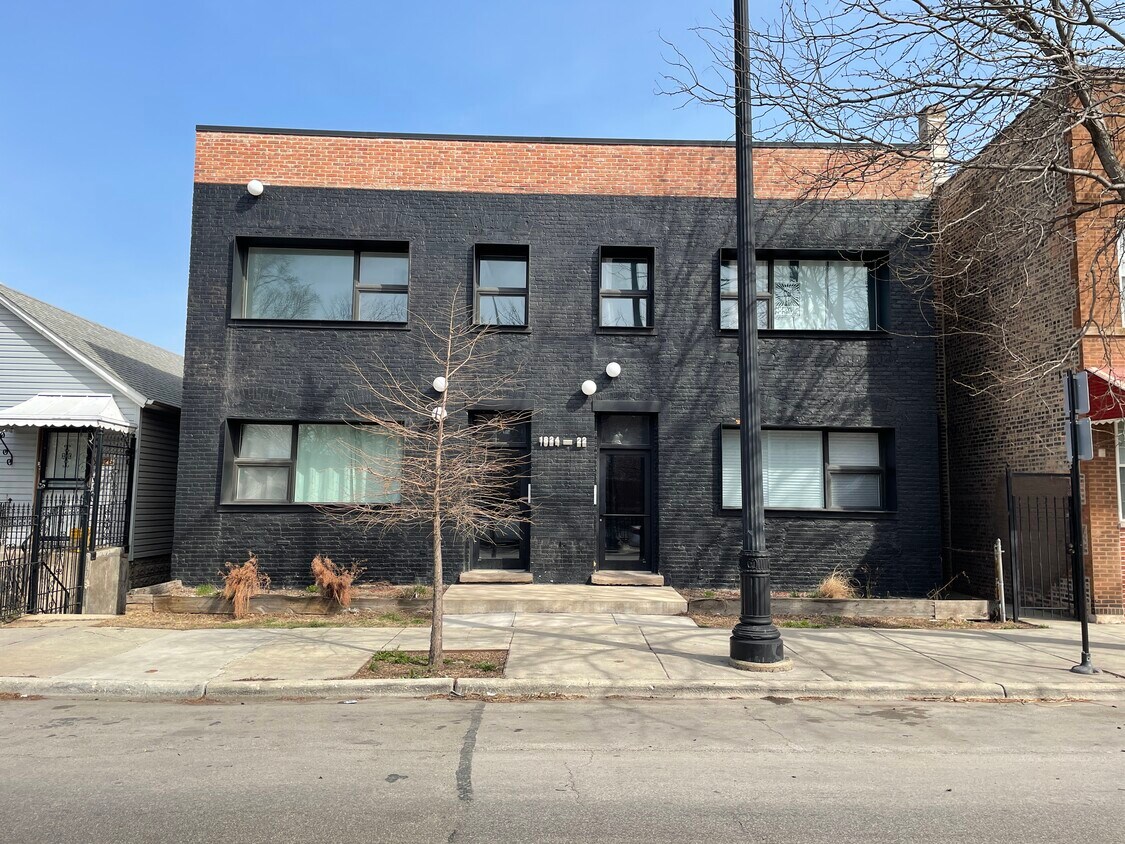 In Unit Laundry and Off Street Parking Included in Price - 1824 W 35th St