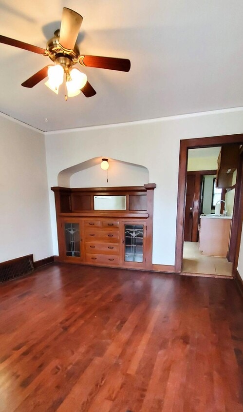 Living Room with original built-in and newly finished wood floors. - 1755 S 71st St