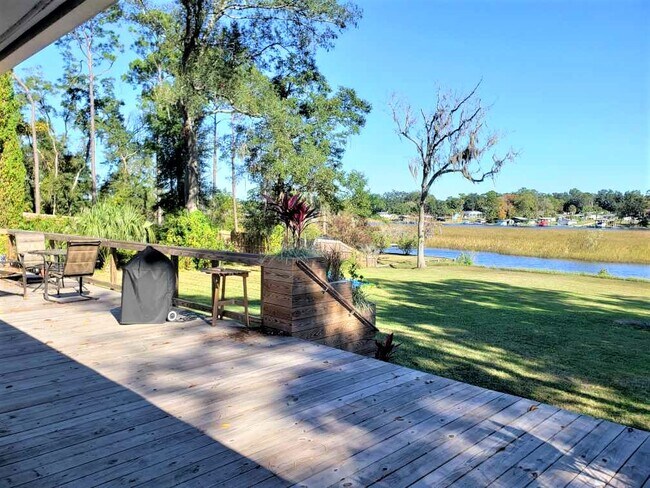 Relax and grill on the large wrap around wood deck - 6325 Kellow Dr