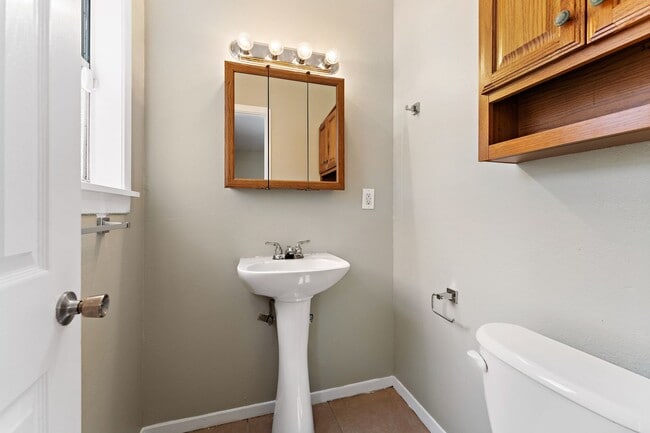 Building Photo - Beautifully remodeled 4 bedroom bath and a half with ceramic tile through out and laminate floori...