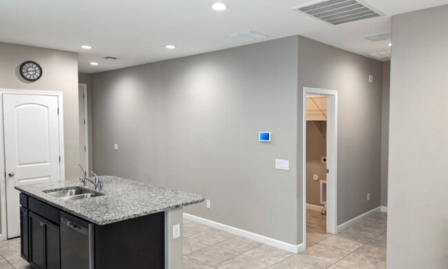Laundry room (garage access), hall to 2 bedrooms and bathroom - 38221 W San Ildefanso Ave